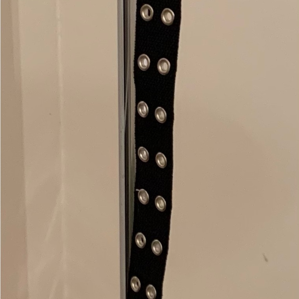 Black belt with silver-look grommets. Almost new!